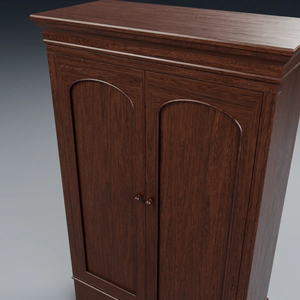 Close-up of the antique wardrobe cornice, arched door panels and wooden knobs