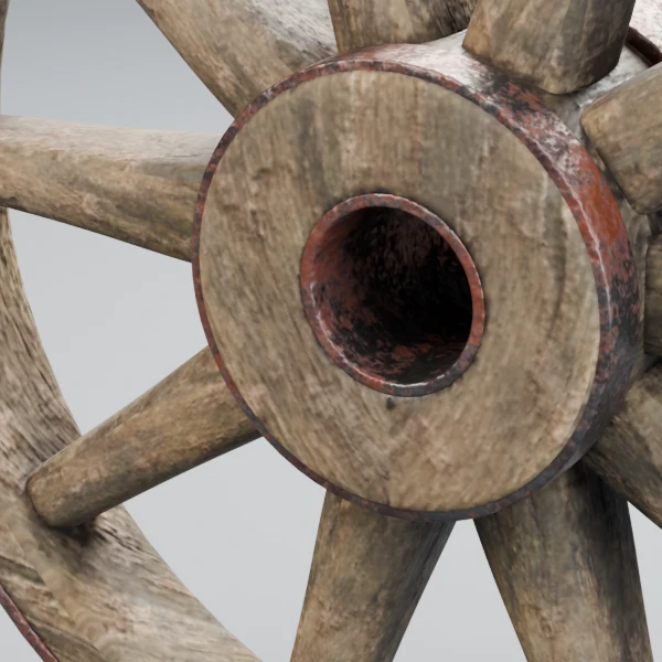 Close up of the wagon wheel hub, spokes and rusty iron band